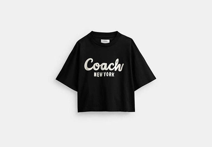 Camiseta corta de firma en cursiva - COACH® - Modalova