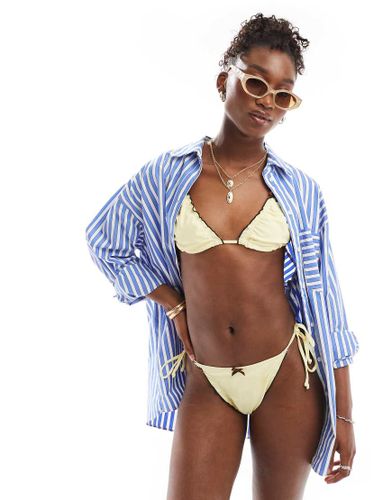 Bas de bikini style lingerie avec nauds - Collusion - Modalova