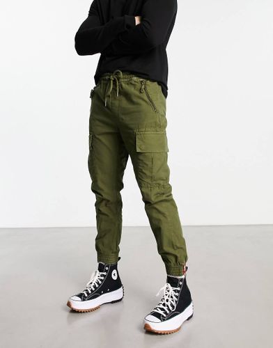 Pantalon de jogging fuselé anti-déchirures - Olive foncé - Alpha Industries - Modalova