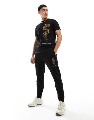 Lunar Capsule - Pantalon de jogging molletonné avec logo et broderie dragon dorée - Armani Exchange - Modalova