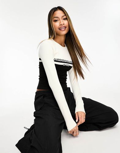 Top sans coutures à manches longues avec rayures et logo - Asos Weekend Collective - Modalova