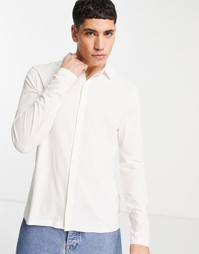 Chemise boutonnée à manches longues en jersey - Crème - Asos Design - Modalova