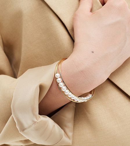 Curve - Bracelet en plaqué or 14 carats avec perles fantaisie - Asos Design - Modalova