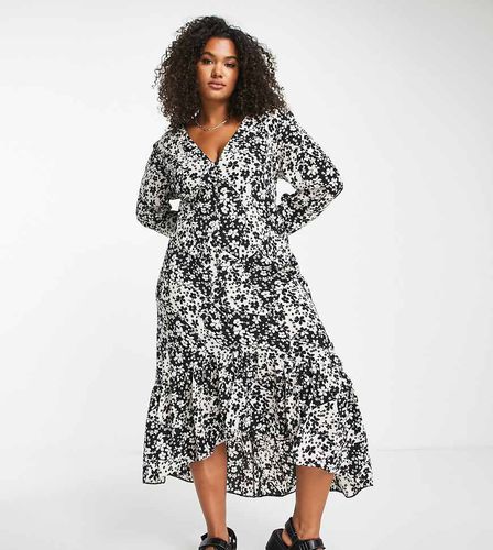 ASOS DESIGN Curve - Robe mi-longue à ourlet asymétrique et imprimé floral varié - Noir - Asos Curve - Modalova