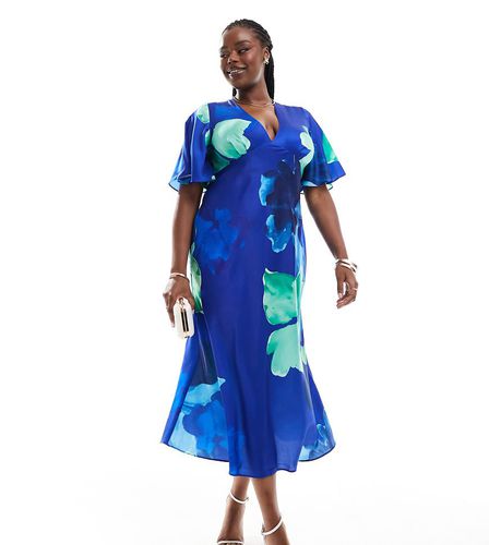 ASOS DESIGN Curve - Robe mi-longue en satin imprimé fleuri à manches évasées - Bleu - Asos Curve - Modalova