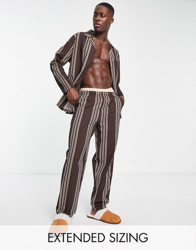 Ensemble de pyjama avec chemise à manches longues et pantalon - à rayures - Asos Design - Modalova