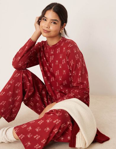 Ensemble de pyjama avec pantalon et top à imprimé nauds - Asos Design - Modalova