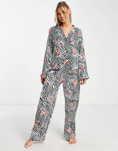 Ensemble de pyjama satiné avec pantalon et chemise à imprimé animal fleuri - Noir et blanc - Asos Design - Modalova