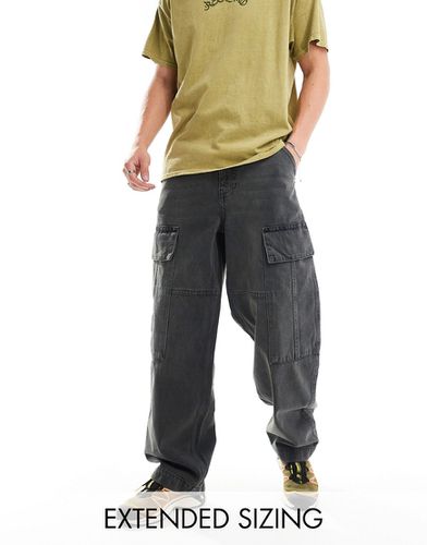Jean large avec poches cargo - délavé teinté - Asos Design - Modalova