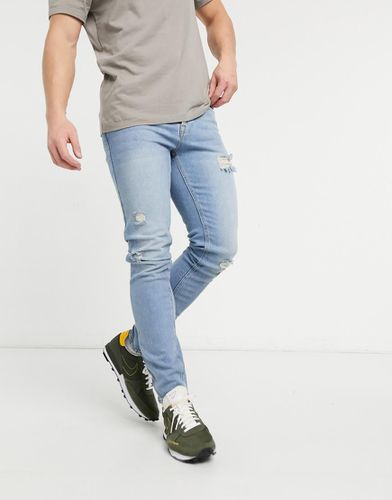 Jean skinny style vintage à déchirures - Délavage clair - Asos Design - Modalova