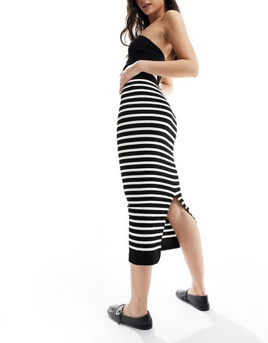 Jupe mi-longue tubulaire sans couture effet sculptant à rayures - Noir et blanc - Asos Design - Modalova