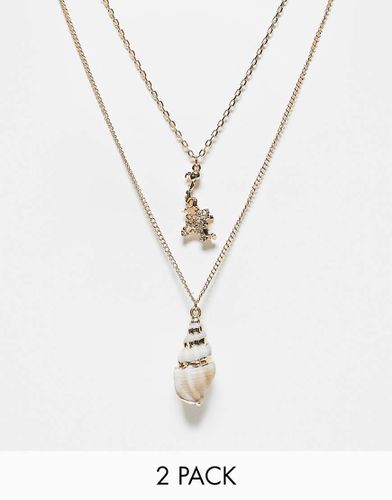 Lot de 2 colliers avec pendentif et breloque faux coquillage - Asos Design - Modalova