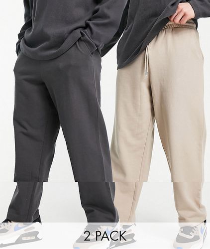 Lot de 2 pantalons de jogging amples - Noir/beige - Asos Design - Modalova