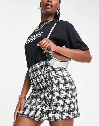 Mini-jupe en tissu bouclé avec boutons et carreaux - Noir et blanc - Asos Design - Modalova
