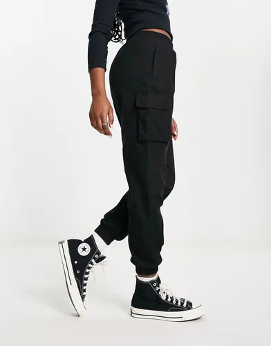 Pantalon cargo style militaire - Noir délavé - Asos Design - Modalova
