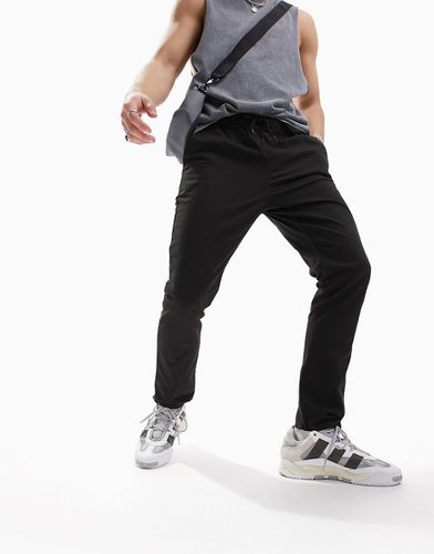 Pantalon chino skinny avec taille élastique - Asos Design - Modalova
