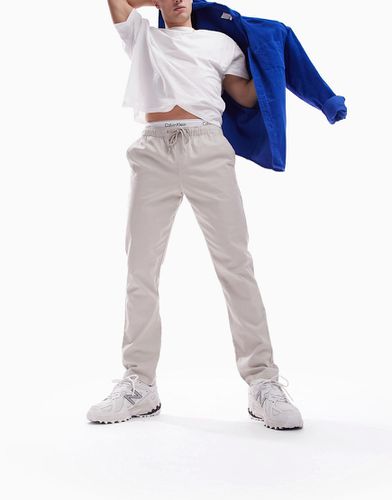Pantalon chino slim à taille élastique - clair - Asos Design - Modalova
