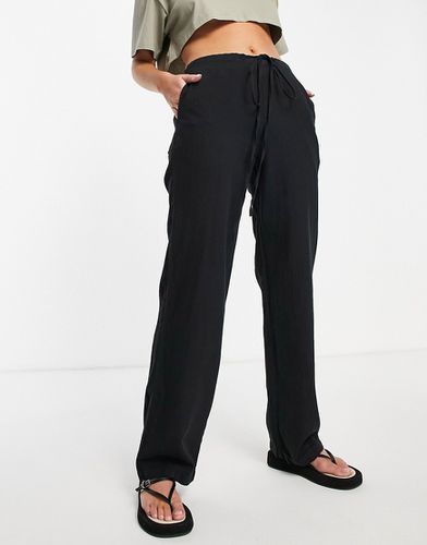 Pantalon ample en lin avec cordon de serrage - ASOS DESIGN - Modalova