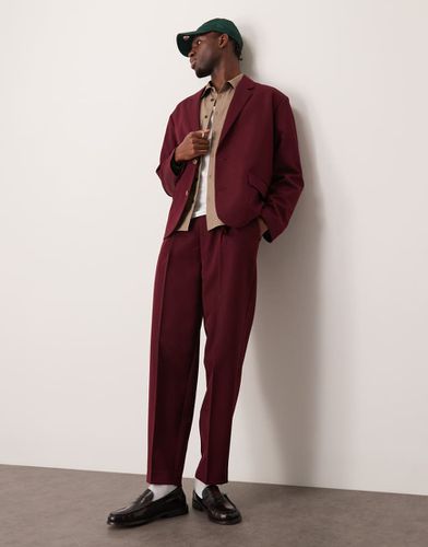 Pantalon de costume oversize coupe fuselée en sergé - Bordeaux - Asos Design - Modalova