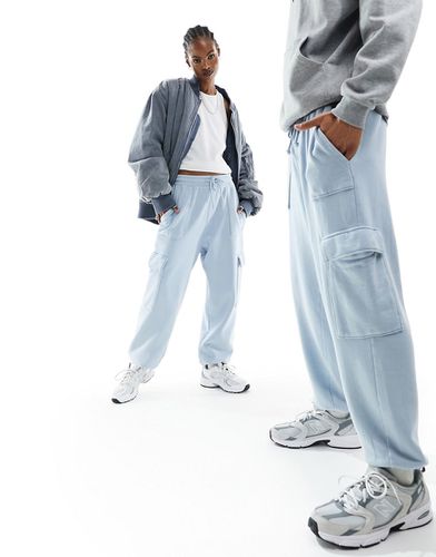 Pantalon de jogging unisexe oversize avec poches cargo - délavé - Asos Design - Modalova