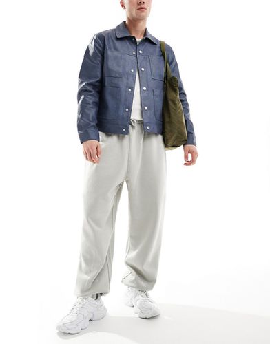 Pantalon de jogging unisexe oversize - délavé - Asos Design - Modalova