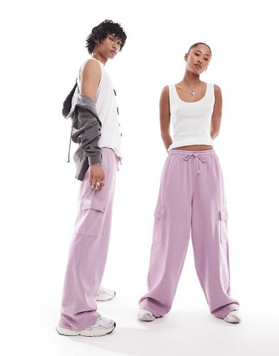 Pantalon de jogging unisexe ample avec poches cargo - Rose délavé - Asos Design - Modalova