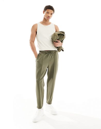 Pantalon de jogging fuselé en néoprène - Kaki - Asos Design - Modalova