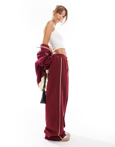 Pantalon de jogging large à rayures latérales contrastantes - Asos Design - Modalova