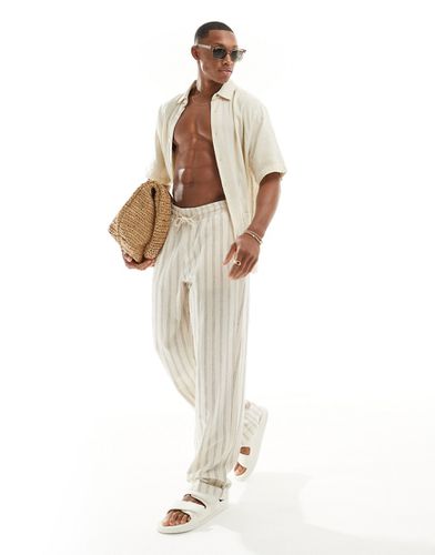Pantalon décontracté en lin à taille élastiquée et rayures texturées - Asos Design - Modalova