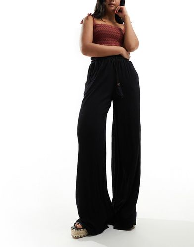 Pantalon large texturé avec liens à pampilles noués à la taille - Asos Design - Modalova