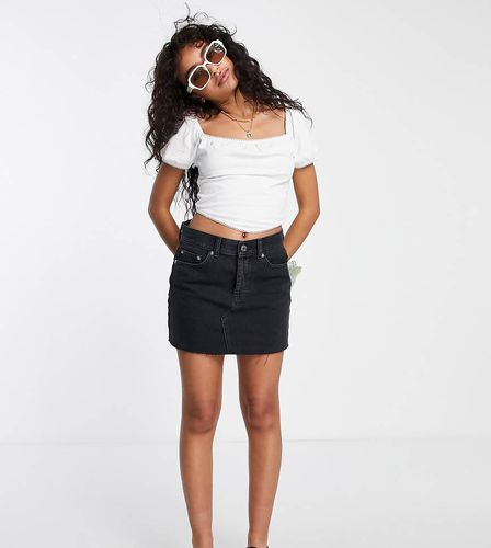 ASOS DESIGN Petite - Mini-jupe à taille mi-haute en denim authentique - délavé - Asos Petite - Modalova