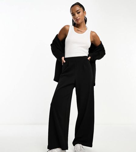 ASOS DESIGN Petite - Pantalon de costume ample et ajusté en jersey - Asos Petite - Modalova