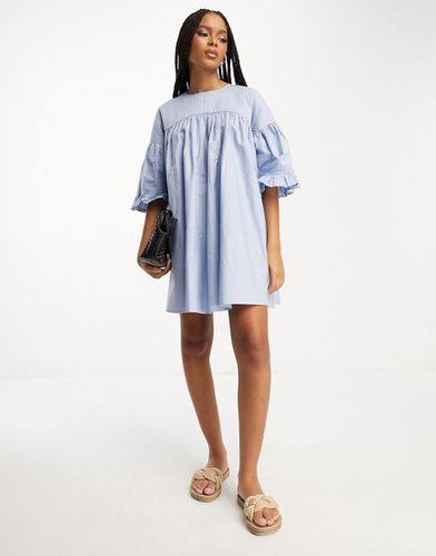 Robe babydoll courte nervurée en coton à manches bouffantes - Asos Design - Modalova