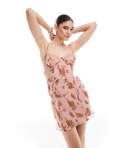 Robe courte coupée en biais à imprimé fleuri avec détail corset et empiècement en dentelle - Rose vintage - Asos Design - Modalova