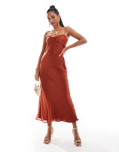 Robe longueur mollet plissée à volants et coupée en biais avec laçage dans le dos - Rouille - Asos Design - Modalova