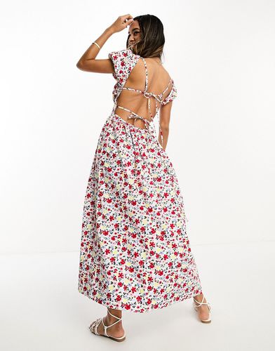 Robe mi-longue tendance folk avec buste froncé et dos nu noué - Imprimé fleurs de couleur vive - Asos Design - Modalova