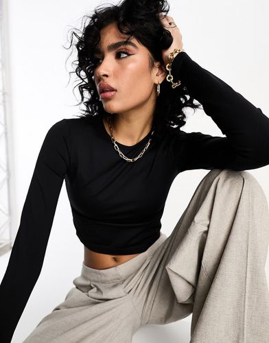 T-shirt crop top sans coutures à manches longues - Noir - Asos Design - Modalova