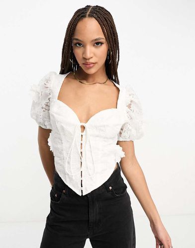 Top corset à manches bouffantes et à nouer devant en dentelle florale 3D - Asos Design - Modalova