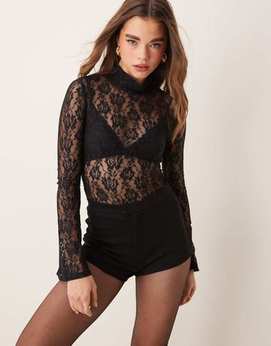 Top transparent en dentelle à col roulé et manches évasées - Asos Design - Modalova