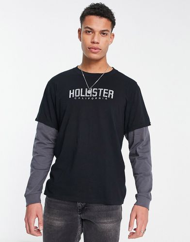 T-shirt effet superposé à manches longues avec logo sur la poitrine et manches grises - Hollister - Modalova