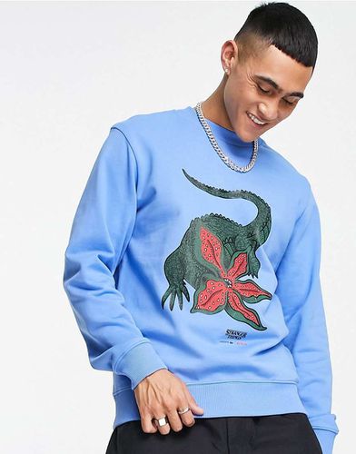 X Stranger Things - Sweat à imprimé graphique - Lacoste - Modalova