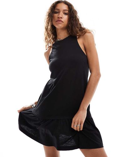 Robe courte sans manches à taille basse en jersey - Monki - Modalova