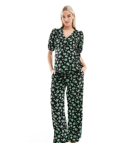 Mamalicious - Pantalon d'ensemble de grossesse passant sous le ventre coupe décontractée - Imprimé fleurs de palmier - Mama.licious - Modalova