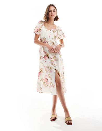 Robe mi-longue boutonnée à fleurs - Mango - Modalova