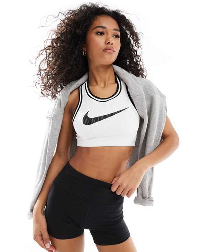 Nike - Training - Brassière de sport en jersey à soutien léger et logo virgule - Nike Training - Modalova