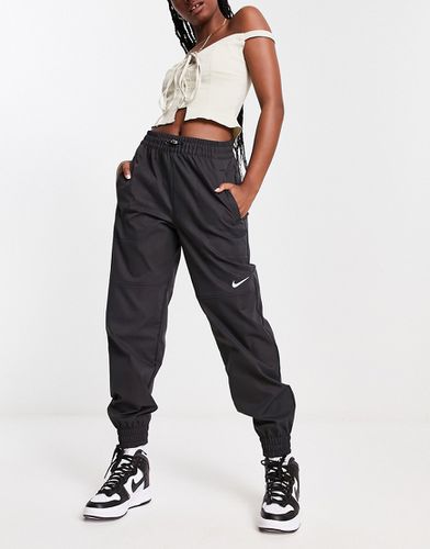 Pantalon cargo tissé à logo virgule - Nike - Modalova