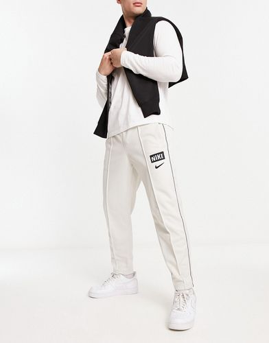 Pantalon de jogging coupe ajustée - Blanc cassé clair - Nike - Modalova