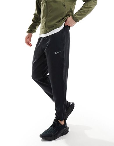 Challenger - Pantalon de jogging en tissu Dri-FIT - Nike Running - Modalova