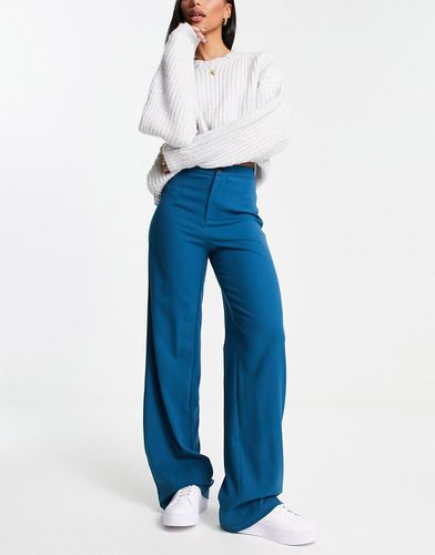 Pantalon taille haute avec surpiqûres à l'avant et détail poche - Pull & bear - Modalova