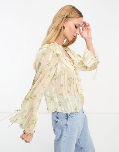 Blouse volantée en mousseline nouée sur le devant - Crème fleuri - River Island - Modalova